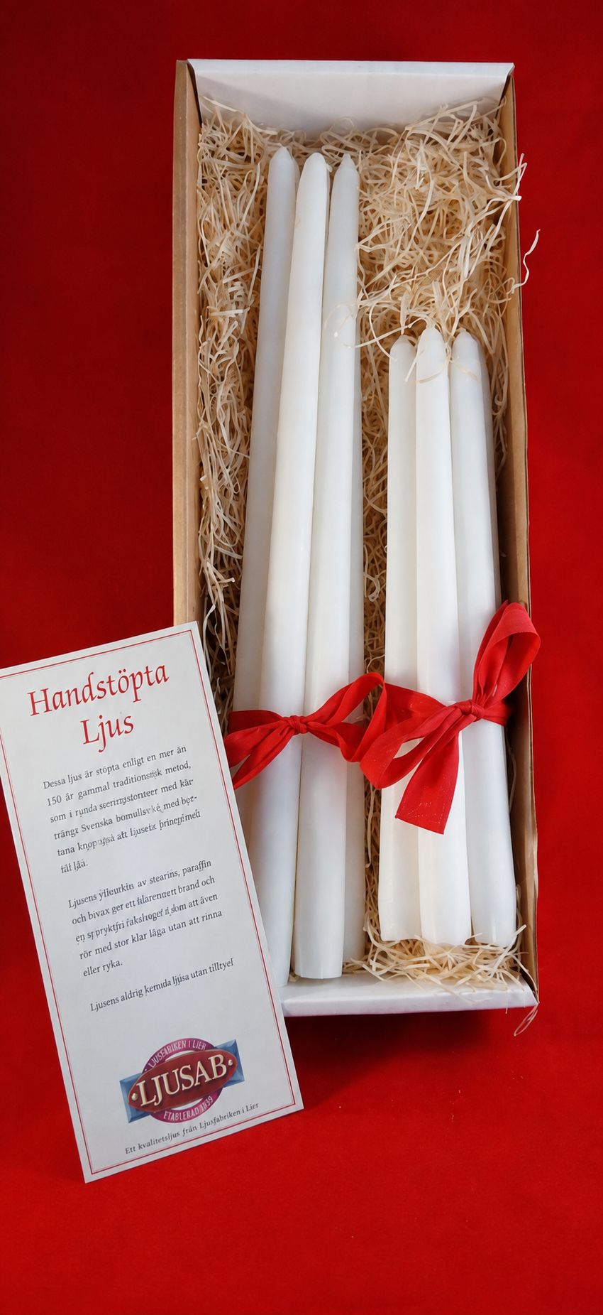 Presentlåda med två knippen handstöpta ljus